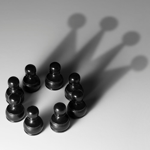 Careers | decorative image is check pieces forming a shadow of a crown.